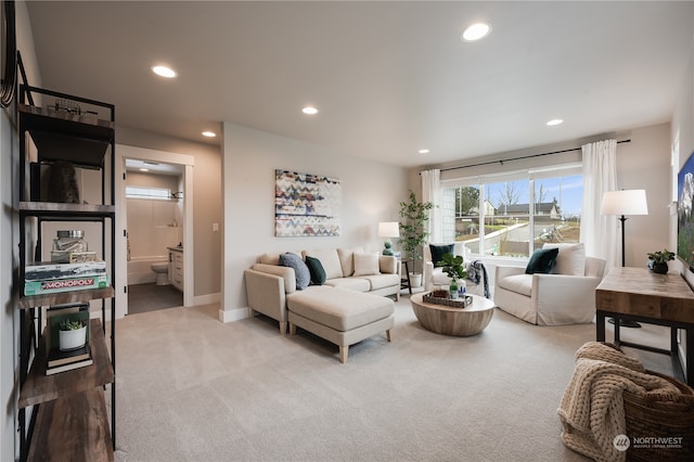 living room with light colored carpet