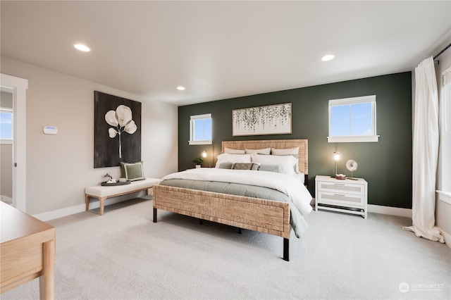 bedroom featuring light carpet