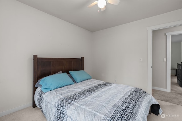 bedroom with light colored carpet and ceiling fan