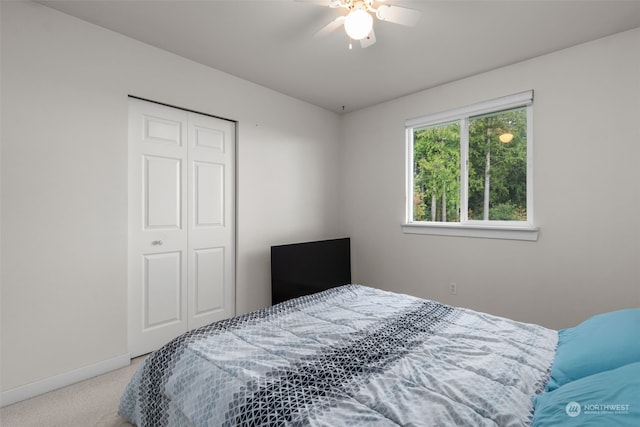 bedroom with carpet floors, a closet, and ceiling fan