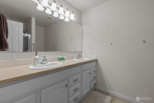 bathroom with vanity and tile patterned floors