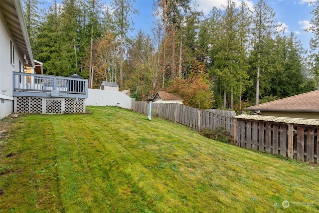 view of yard with a wooden deck