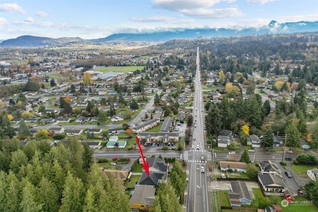 drone / aerial view featuring a mountain view