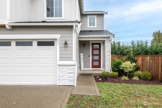 view of exterior entry featuring a garage