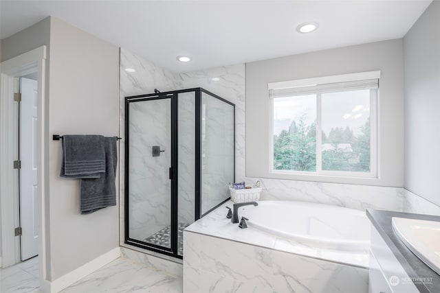 bathroom featuring vanity and shower with separate bathtub