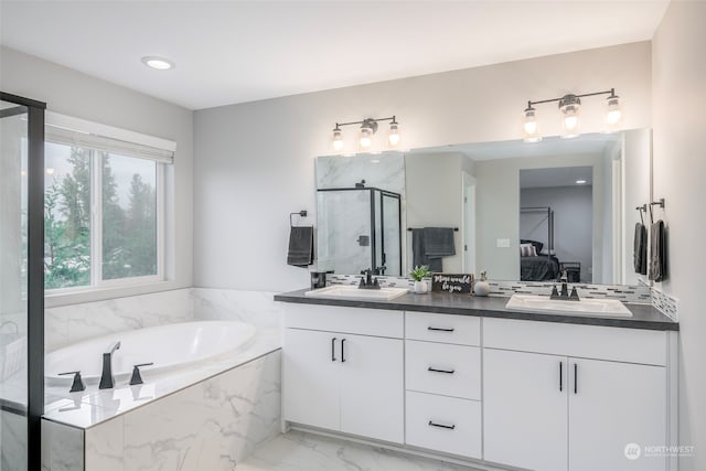 bathroom with vanity and plus walk in shower