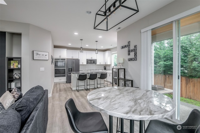 dining space featuring light hardwood / wood-style flooring