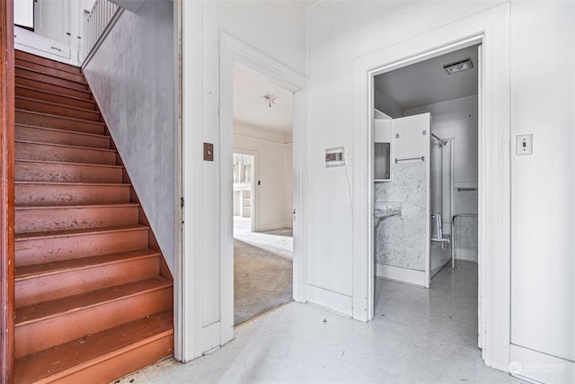 stairway with concrete floors