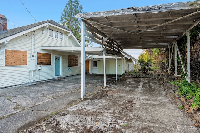 view of car parking featuring a carport