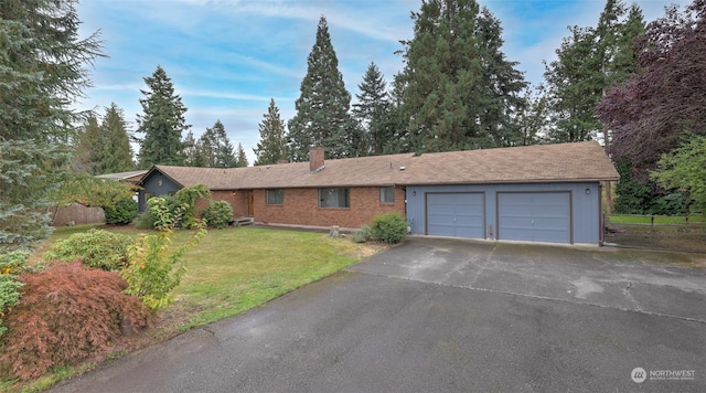 ranch-style house with a front lawn and a garage