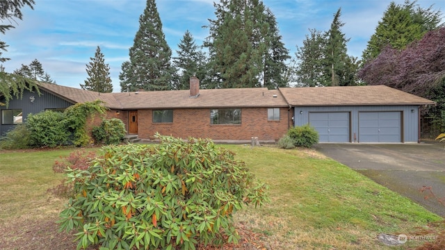 single story home with a front yard and a garage