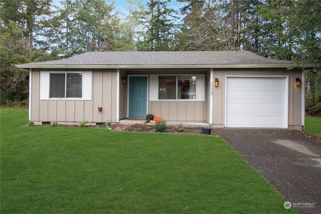 ranch-style home featuring a garage and a front yard