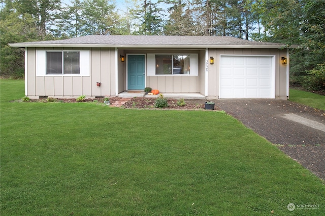 single story home with a garage and a front yard