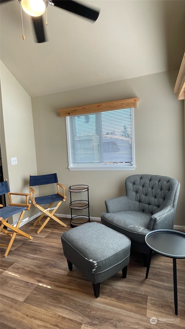 sitting room with hardwood / wood-style flooring, ceiling fan, a healthy amount of sunlight, and vaulted ceiling