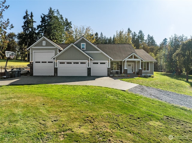 view of front of house featuring a garage and a front lawn