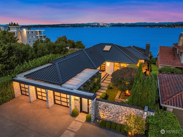 view of front of house featuring a water view