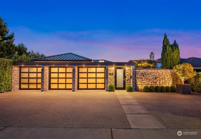 view of front of property with a garage