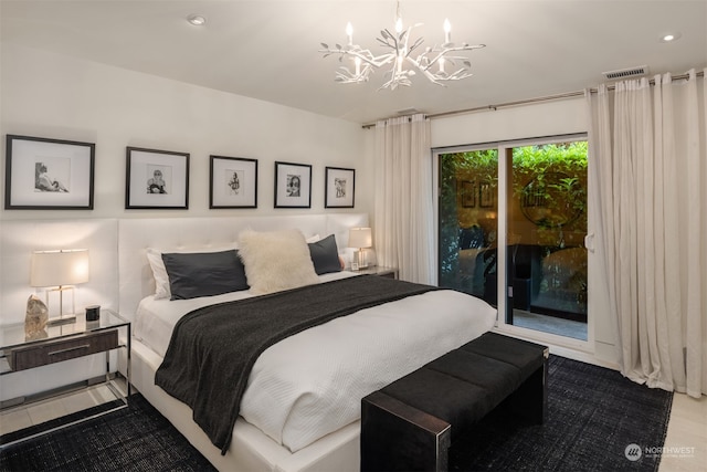 bedroom with an inviting chandelier and access to exterior