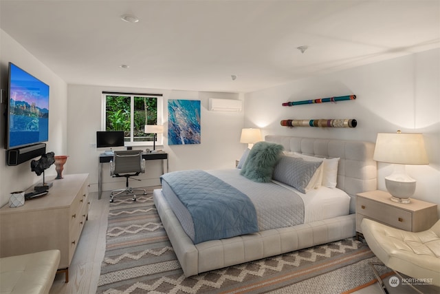 bedroom featuring an AC wall unit