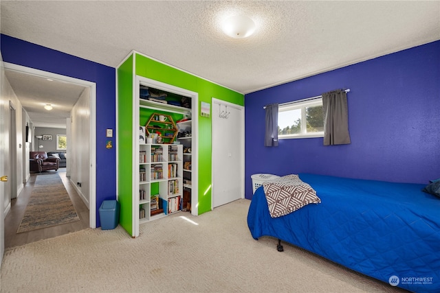 unfurnished bedroom featuring carpet floors and a textured ceiling