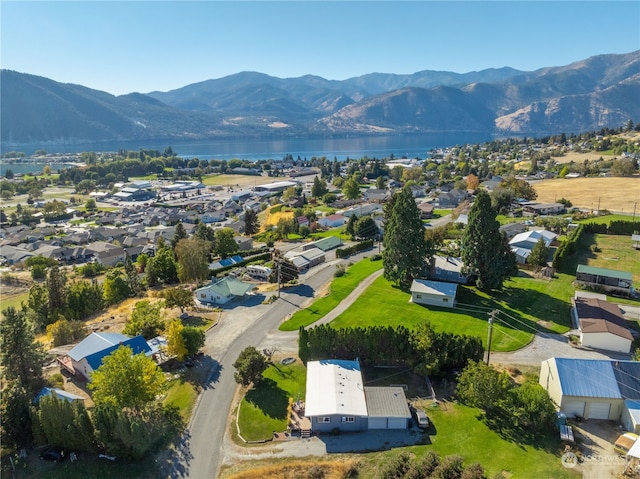 birds eye view of property featuring a water and mountain view