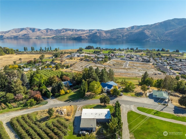 bird's eye view featuring a water and mountain view