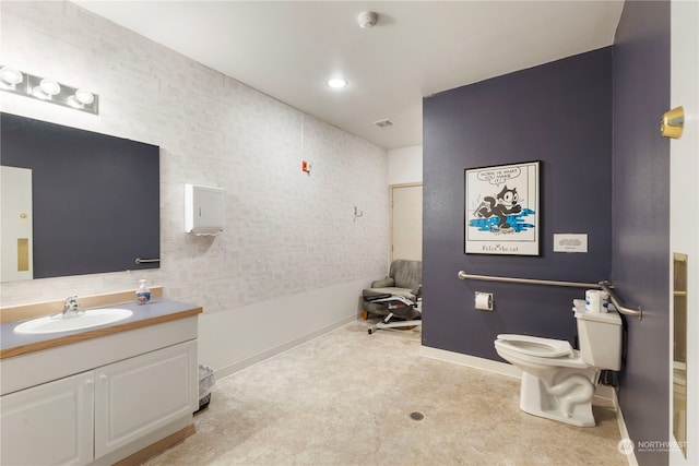 bathroom featuring walk in shower, vanity, and toilet