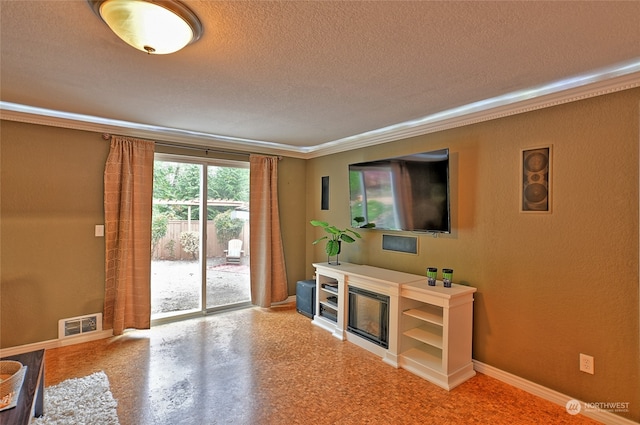 living room with crown molding and a textured ceiling