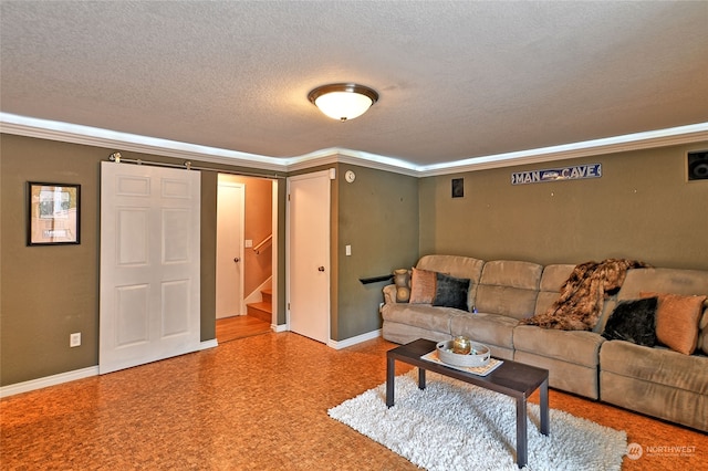 living room with crown molding and a textured ceiling