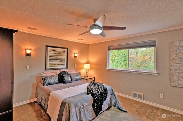 bedroom featuring ceiling fan, crown molding, a textured ceiling, and dark colored carpet