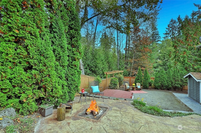 view of patio / terrace with a fire pit