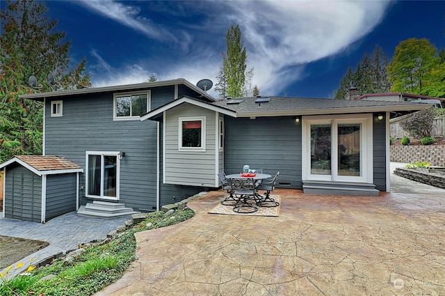 rear view of property with a patio area