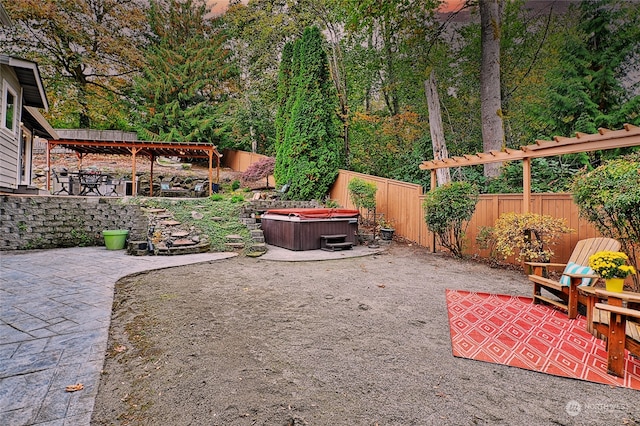 view of yard featuring a hot tub and a patio area