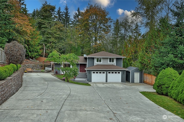 view of front of house with an outbuilding and a garage