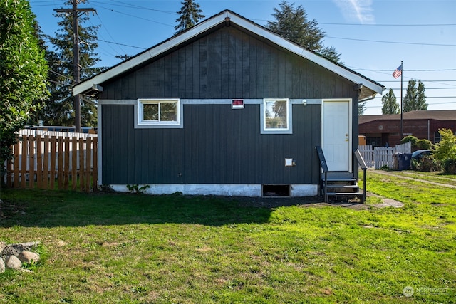 view of home's exterior with a lawn