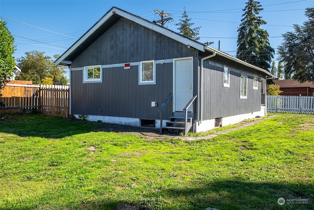 view of home's exterior with a yard