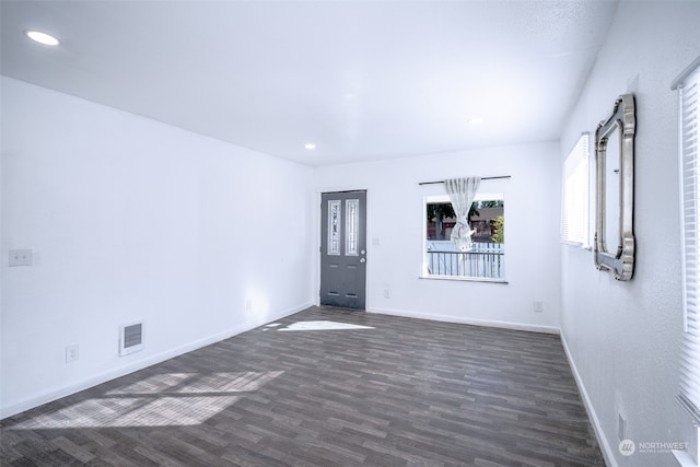 unfurnished room with dark hardwood / wood-style floors