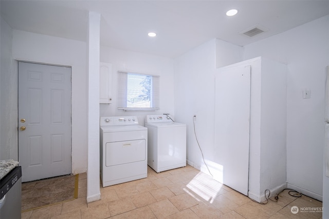 laundry area with independent washer and dryer