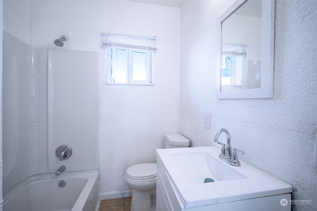 full bathroom with vanity, bathing tub / shower combination, toilet, and tile patterned flooring