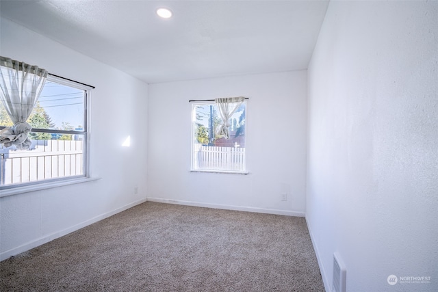 empty room with carpet flooring