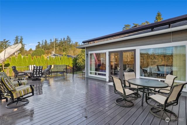 wooden deck featuring an outdoor living space