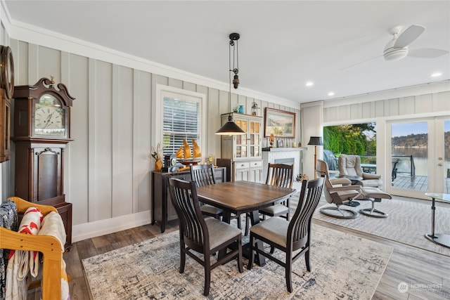 dining area with ceiling fan, hardwood / wood-style floors, and ornamental molding