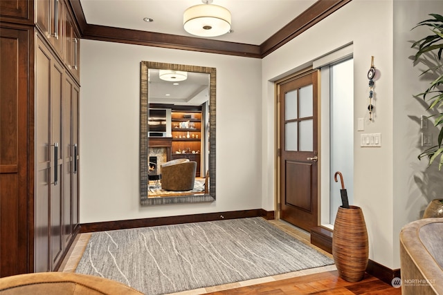 hall featuring crown molding and hardwood / wood-style floors