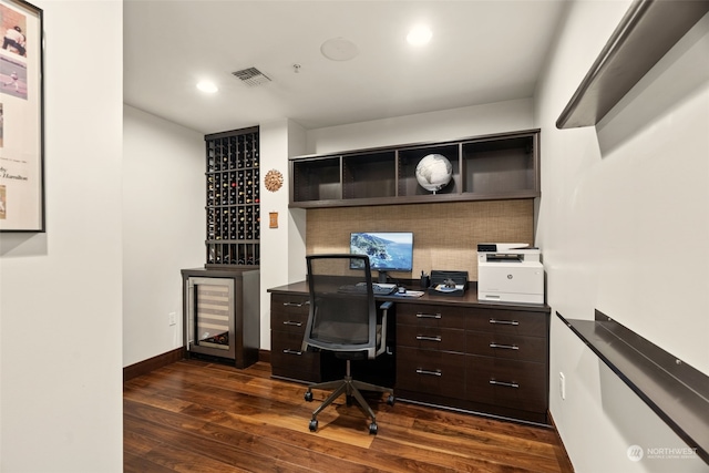 home office featuring dark hardwood / wood-style floors and beverage cooler