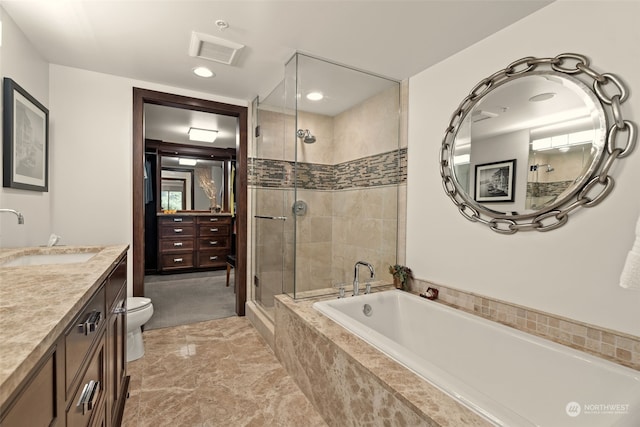 full bathroom featuring independent shower and bath, vanity, and toilet