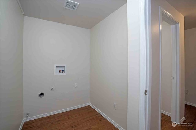 laundry area featuring hookup for an electric dryer, hookup for a washing machine, and dark hardwood / wood-style floors