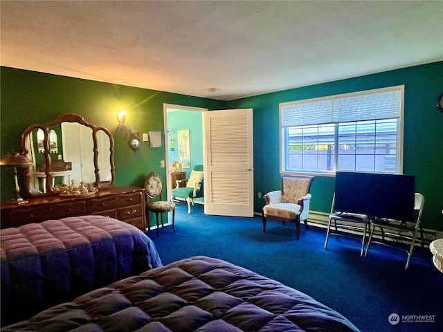 carpeted bedroom featuring a textured ceiling