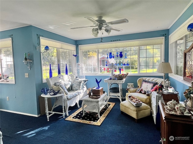 sunroom / solarium featuring ceiling fan