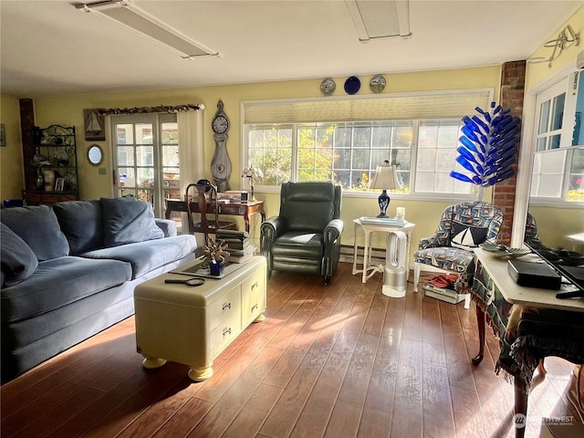 living room featuring a baseboard radiator and hardwood / wood-style floors