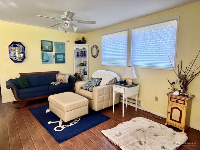 living room with ceiling fan and dark hardwood / wood-style flooring